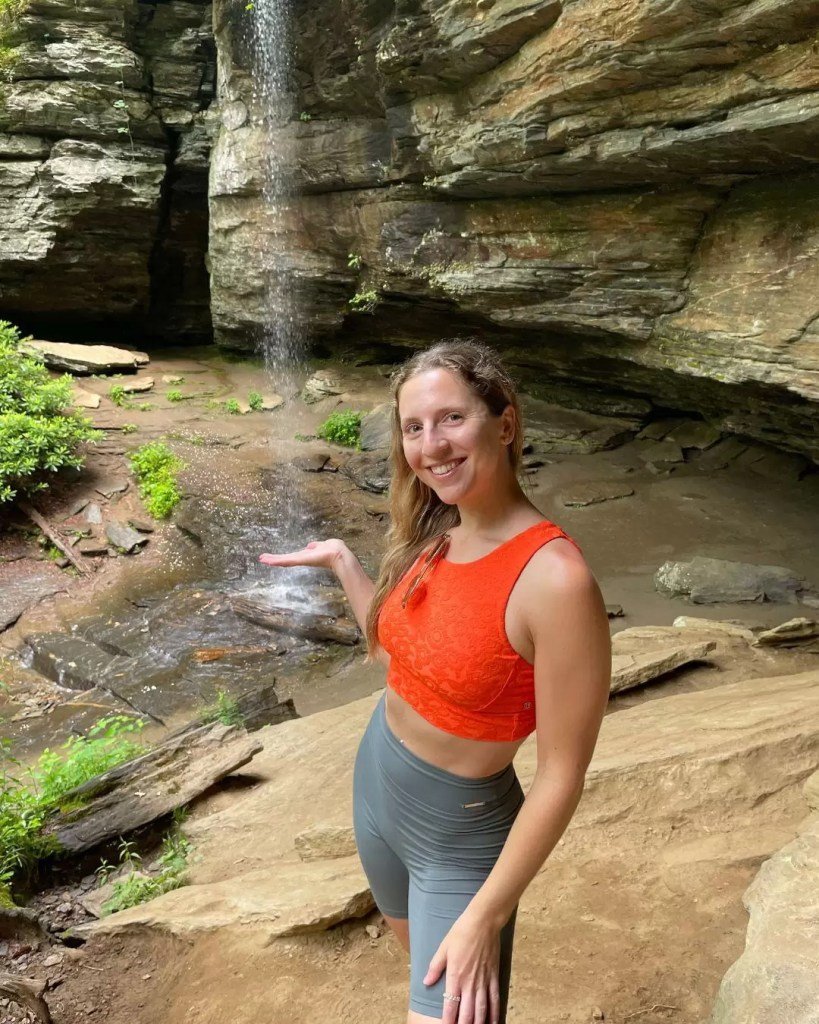 girl standing at moore cove falls in north carolina