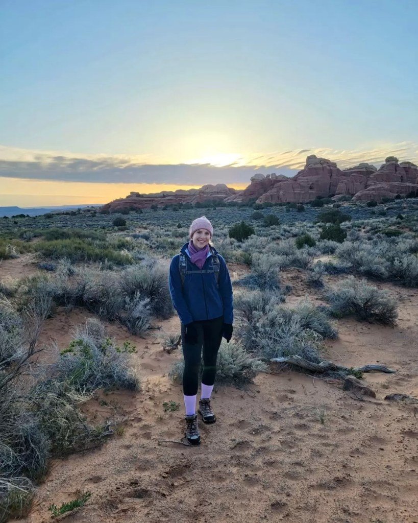 Woman hiker on devils garden trail for sunrise